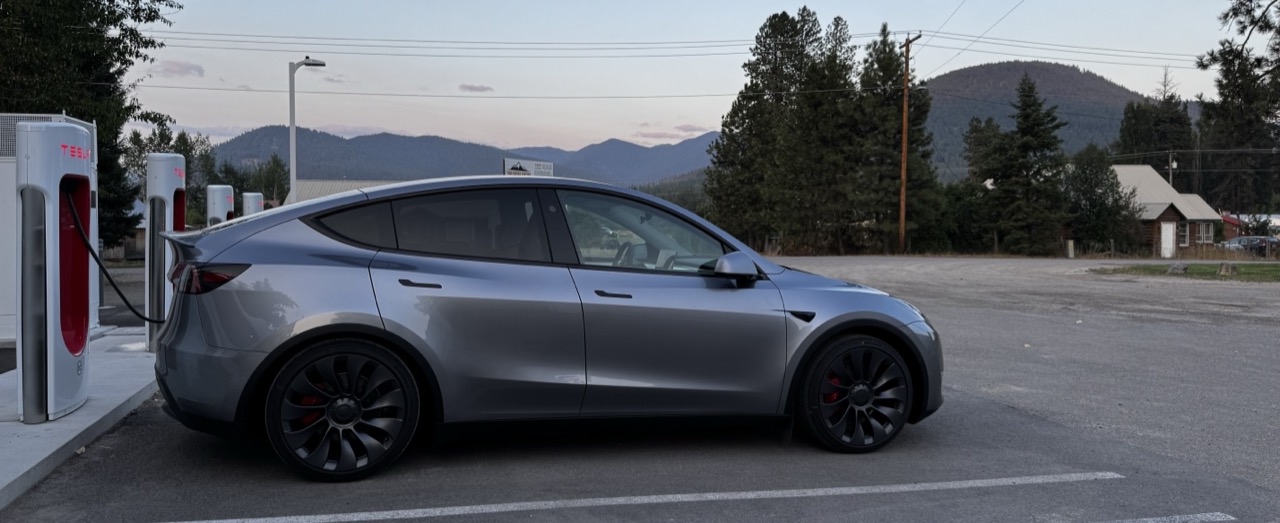 A Tesla charging at dusk — an accepted photo